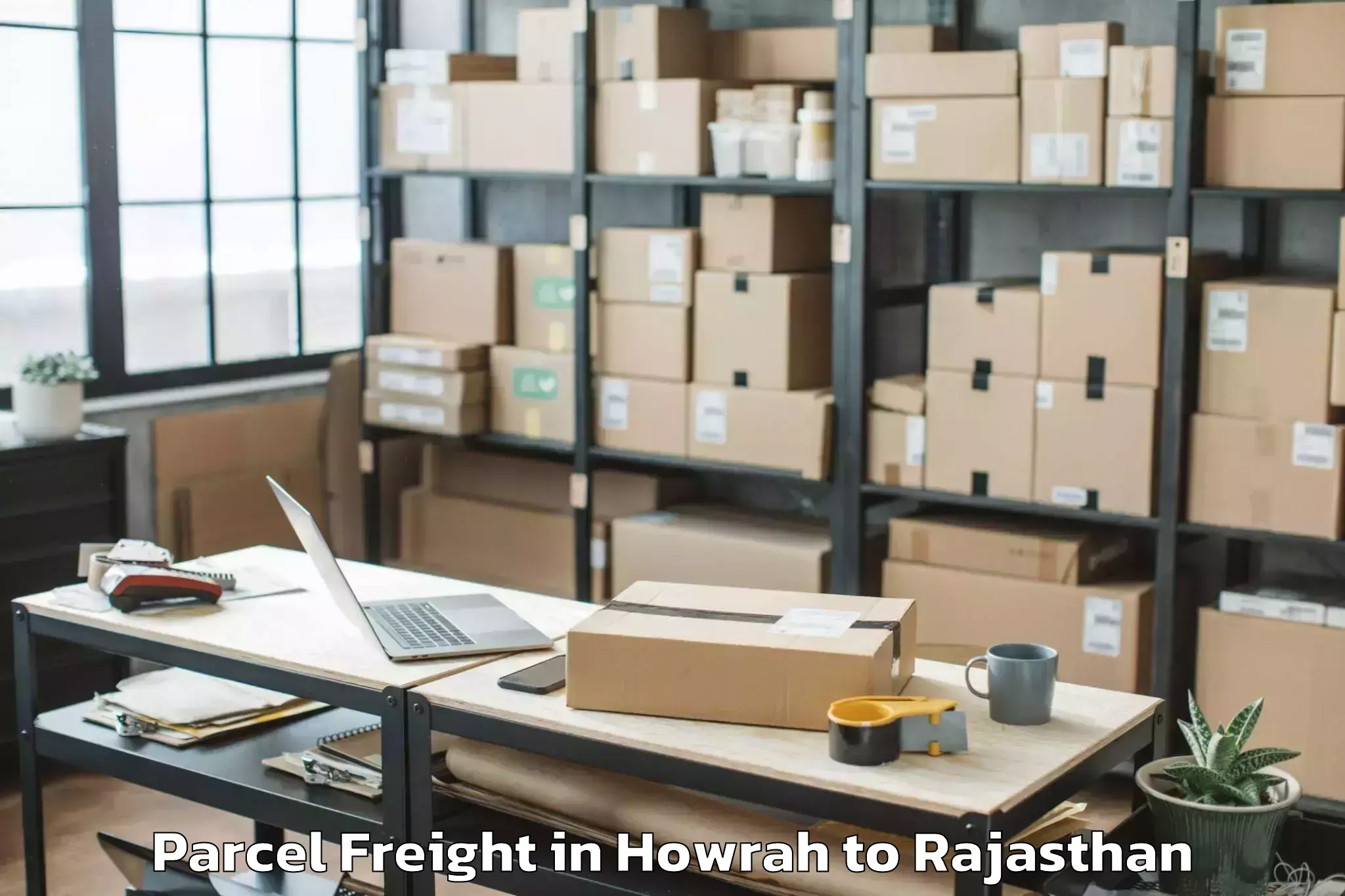 Book Your Howrah to Opjs University Churu Parcel Freight Today